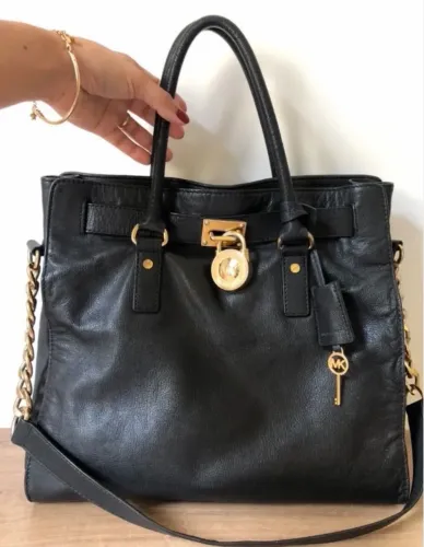 Bolsa original couro  da MK com número de série 