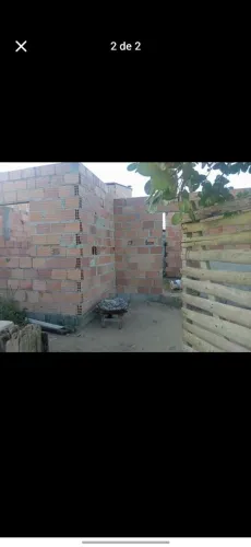 Vende-se lote com construção