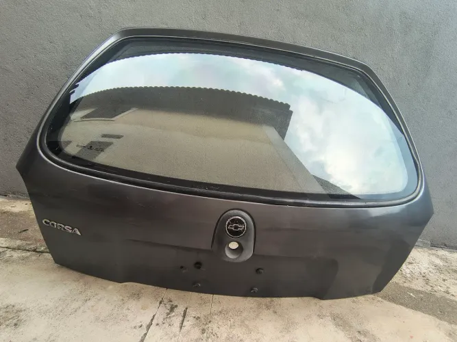 Tampa Porta Malas GM - Corsa Wind - Com Vidro