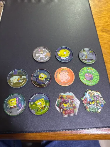 Lote com 11 Tazos variados