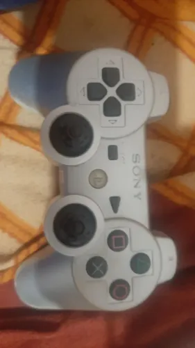 Controle original com defeitos.