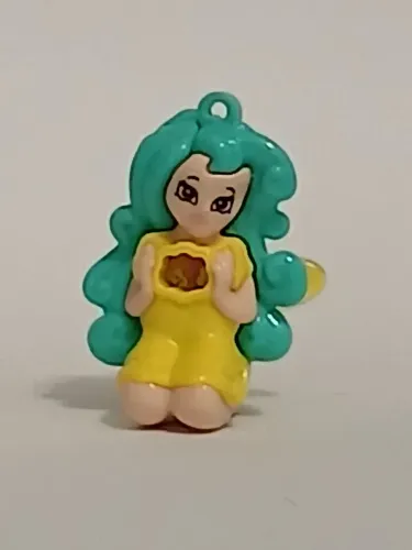 Brinquedo Kinder Ovo fadinha ajoelhada amarela