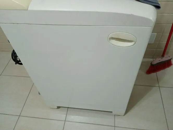 Máquina de lavar com defeito 