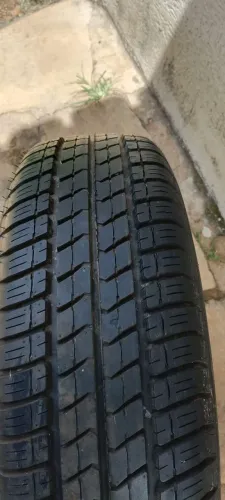 Vendo pneu Firestone Firewall aro 14 semi novo com roda de ferro