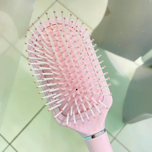 Escova de cabelo rosa