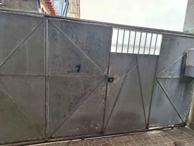Portão de garagem  com portão social ferro 