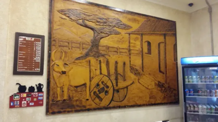 quadro decorativo escupido em madeira