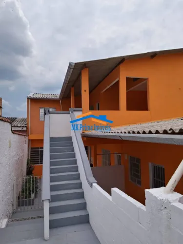 Terreno com 6 Casas e Renda: Oportunidade de Investimento.