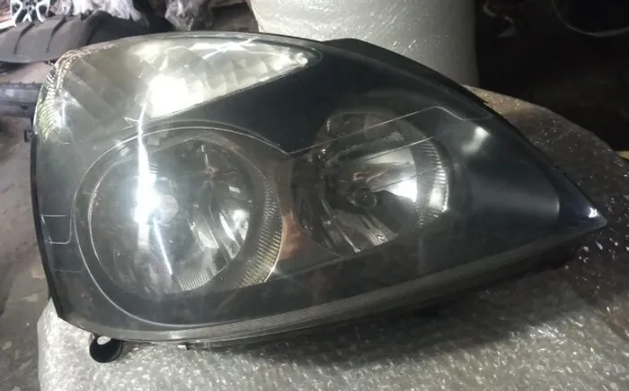 Farol Clio 2003-2012 lado direito.