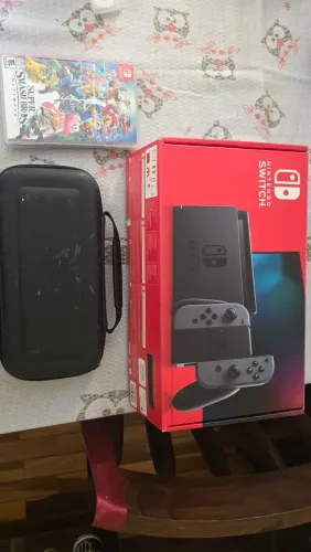 Vendo Nintendo Switch + 3 jogos + capa