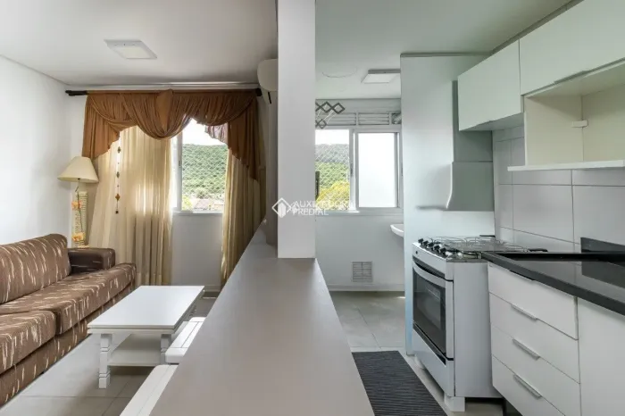 Apartamento de 2 quartos, mobiliado, com 1 vaga à venda, próximo à UFRGS.