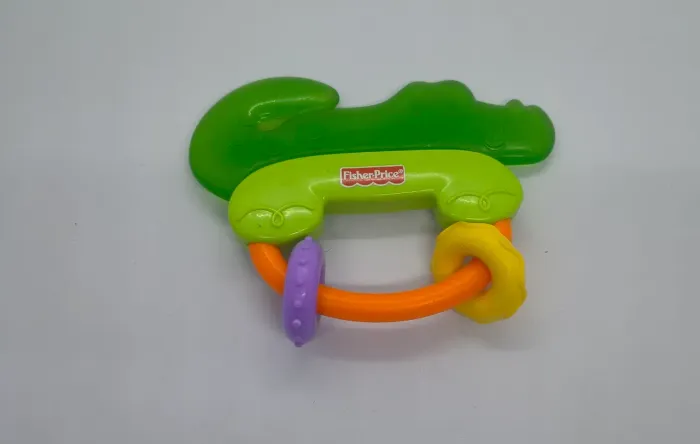 Chocalho e mordedor infantil jacaré da Fisher-Price.