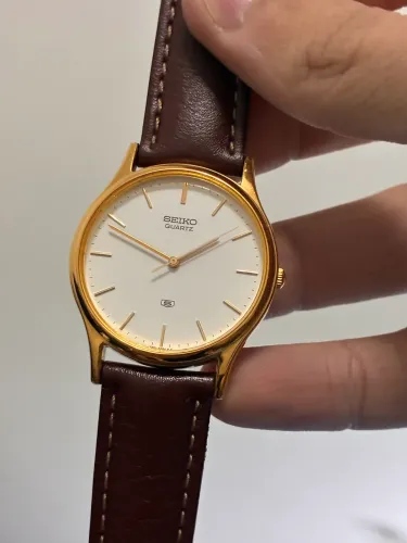 Relógio vintage Seiko 5 quartz dourado 