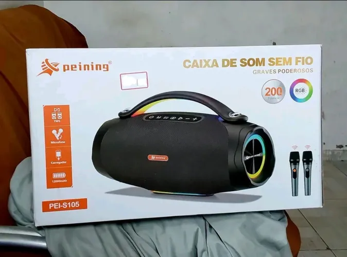 Caixa de som Peining Bluetooth, com 2 microfones sem fio, graves exelentes.Com nota fiscal