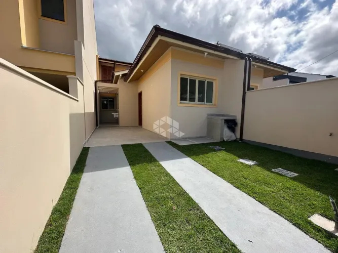 CASA GEMINADA COM 2 DORMITÓRIOS, SENDO 1 SUÍTE EM SÃO JOSÉ SC, BAIRRO FORQUILHAS