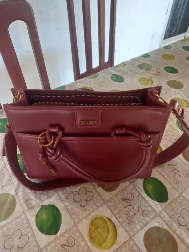 Bolsa Santa Lolla, camisa do Remo feminina (P), par de brinco e pulseira Rommanell