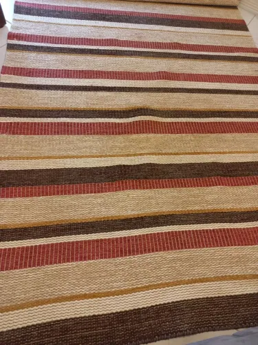 Tapete de sisal e algodão.
