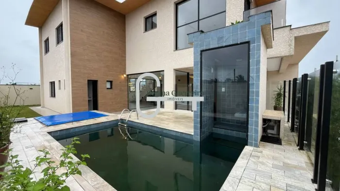 Casa com 4 dormitórios à venda, 231 m² por R$ 1.890.000,00 - Condomínio Flora Rica - Peruí