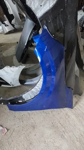 Paralama Peugeot 208 esquerdo 2021 2026