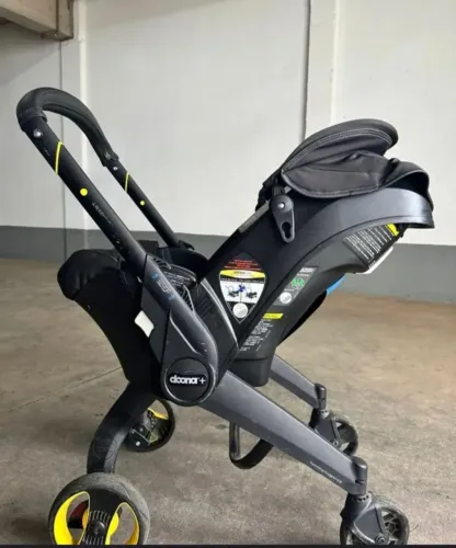 Bebê conforto com carrinho Doona