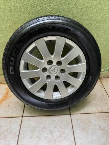 RODA MITSUBISHI ARO 18 ORIGINAl + PNEUS BRIDGESTONE