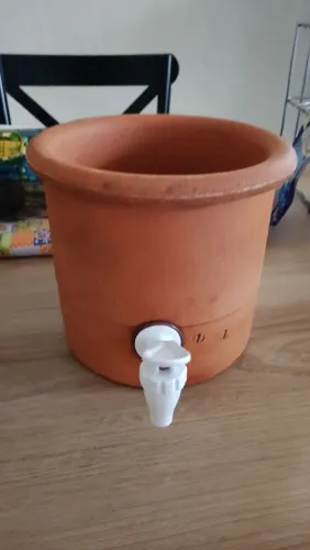 Base de barro para galão de água
