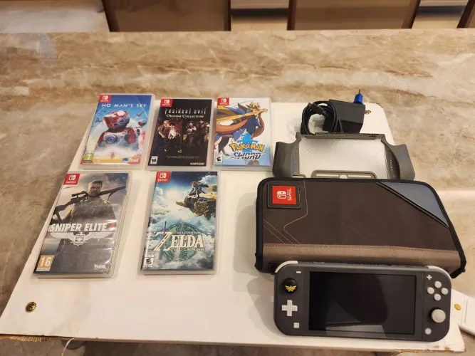 Nintendo Switch Lite cinza + 5 jogos e acessórios. Original tudo novinho.