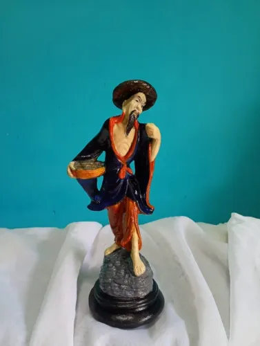 Antiga escultura chinesa em resina O pescador 