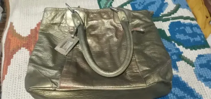 Bolsa   de  couro  le postiche