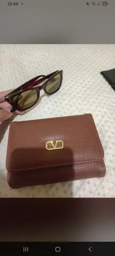 Vendo óculos e bolsa