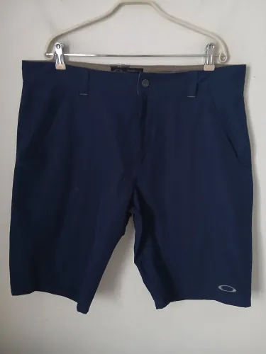 BERMUDA OAKLEY GOLF ORIGINAL AZUL ESCURO N48/50 EM ÓTIMAS CONDIÇÕES