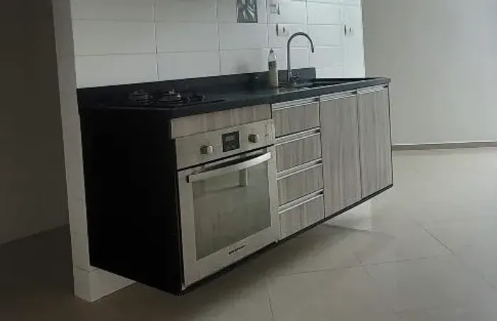 Armários de cozinha e pia com forno e fogão