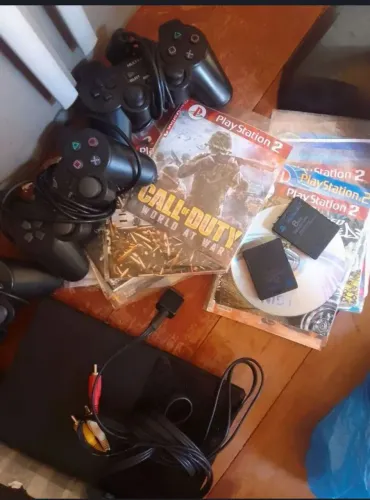 Vendo ps2 com 3 controles 2 memori card e vários jogos