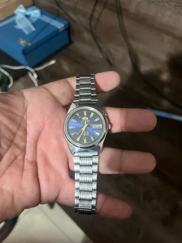 Relógio orient 3 estrelas vintage fundo azul