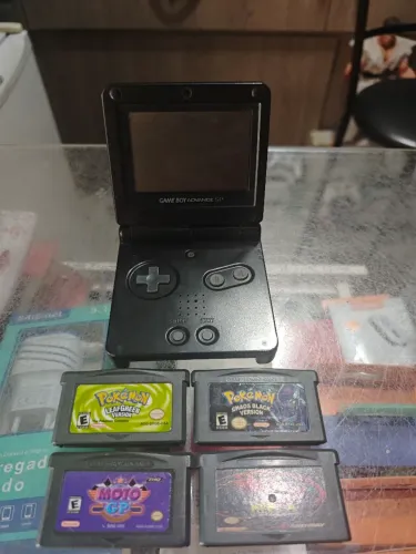 Game boy sp todo original 4 fitas , carregador completo ac trocas