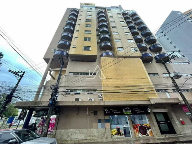 APARTAMENTO DE DOIS DORMITÓRIOS COM SUITE MOBILIADO, COM VAGA DE GARAGEM NO CENTRO