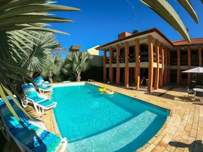 Casa com piscina e ar + 5 suítes, 550 m² - venda por R$ 2.950.000 ou aluguel de temporada