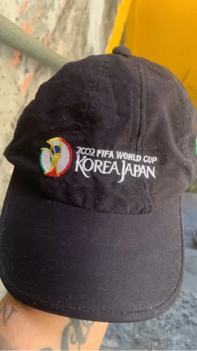 Boné copa 2002 poliéster 
