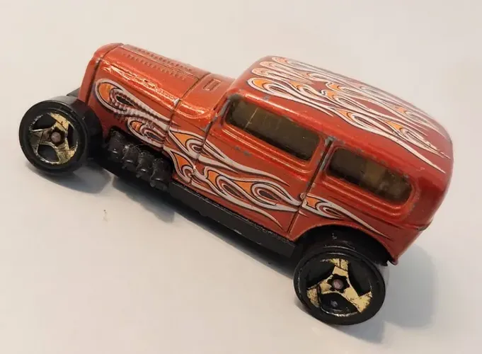 Miniatura Hot Wheels esc. 1:64 Mattel- midinight Otto A44 - Laranja