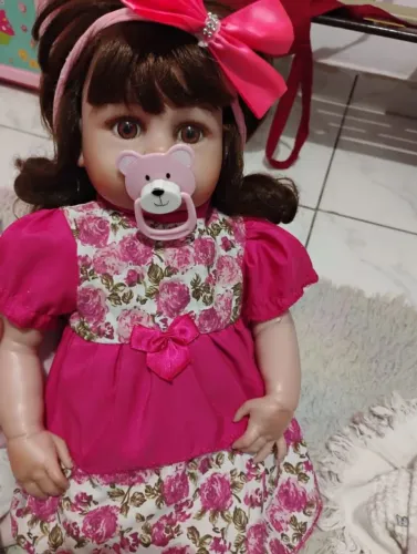 Boneca reborn com carrinho de passeio