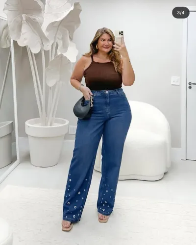 Calça jeans com ilhós na barra marca izzat 48