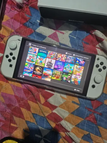 Nintendo switch oled desbloqueado com cartão de 256 gigase vários acessórios