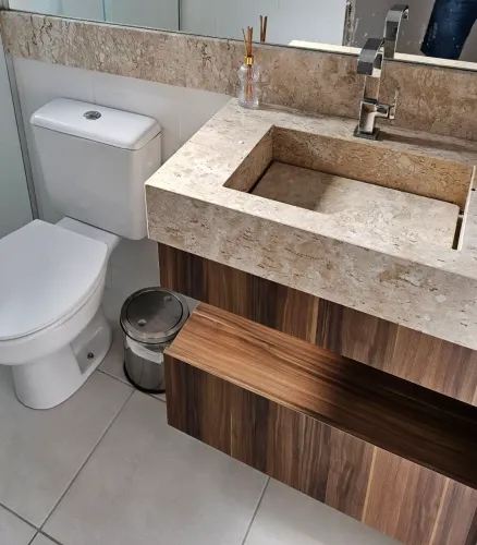 Cuba esculpida em travertino + balcão em MDF
