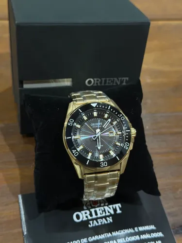 Relógio Orient Solartech dourado fundo preto novo e original!