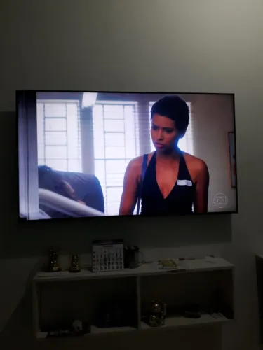 smart tv Samsung 55 com lista no canto