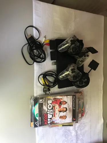 PS2 completo, 2 controles e vários jogos