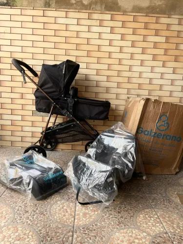 Kit carrinho + bebê conforto e base novo na caixa galzerano