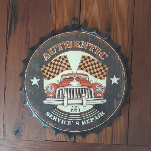 Placa decorativa em formato de tampa