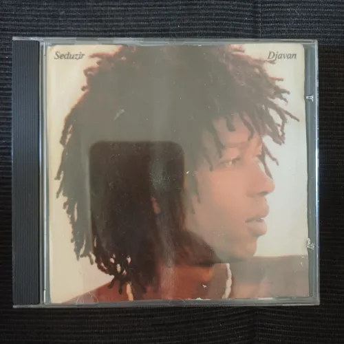 Djavan seduzir cd encarte molhou,, grudou as paginas, capa da frente está ok. cd otimo