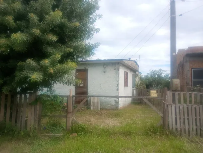Terreno com casa ótima localização